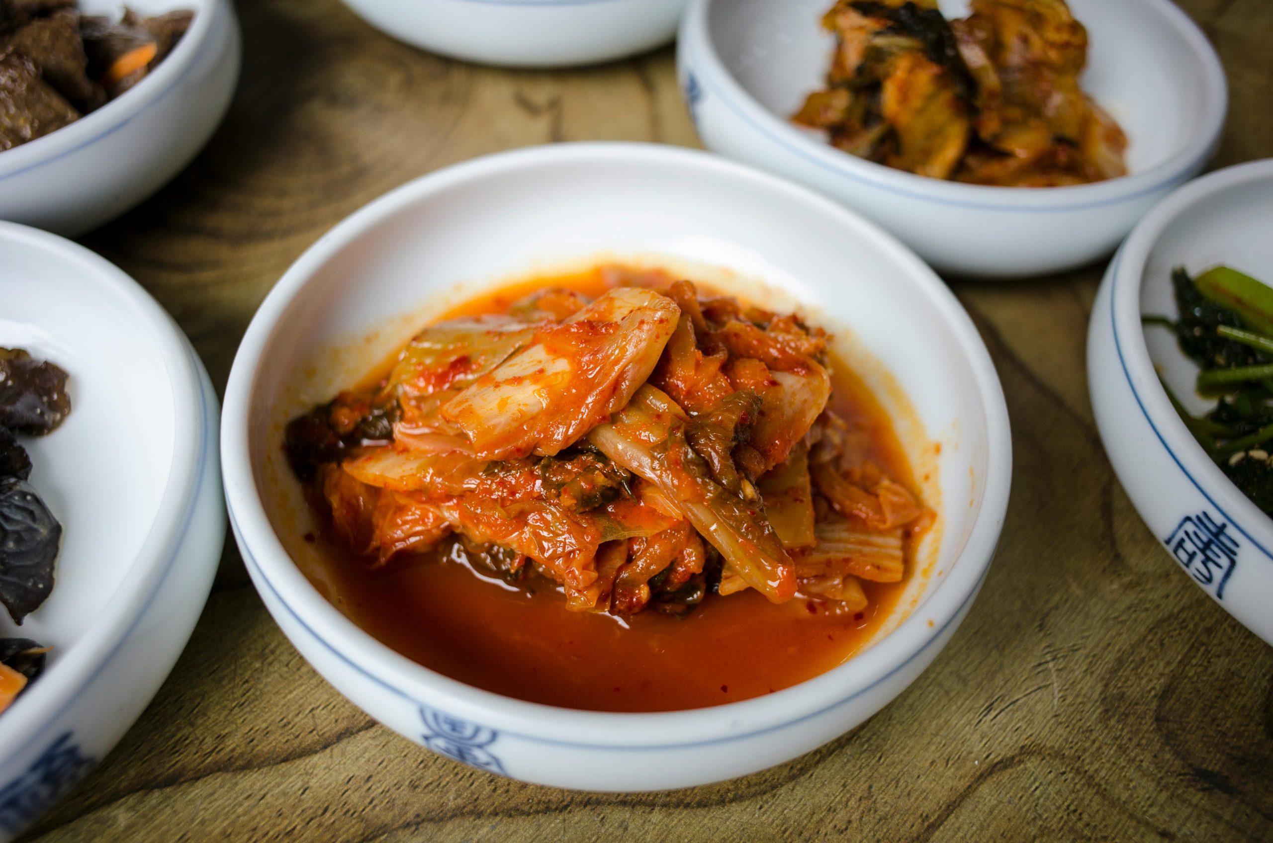 Close-up of flavorful Korean kimchi served in a traditional dish.